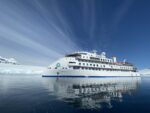 IKARUS TOURS & PolarNews / Das Expeditionsschiff „Greg Mortimer“ in der Antarktis – unterwegs in einer der letzten unberührten Regionen der Erde. Expeditionsreisen erleben weltweit einen starken Boom. © Scott Portelli